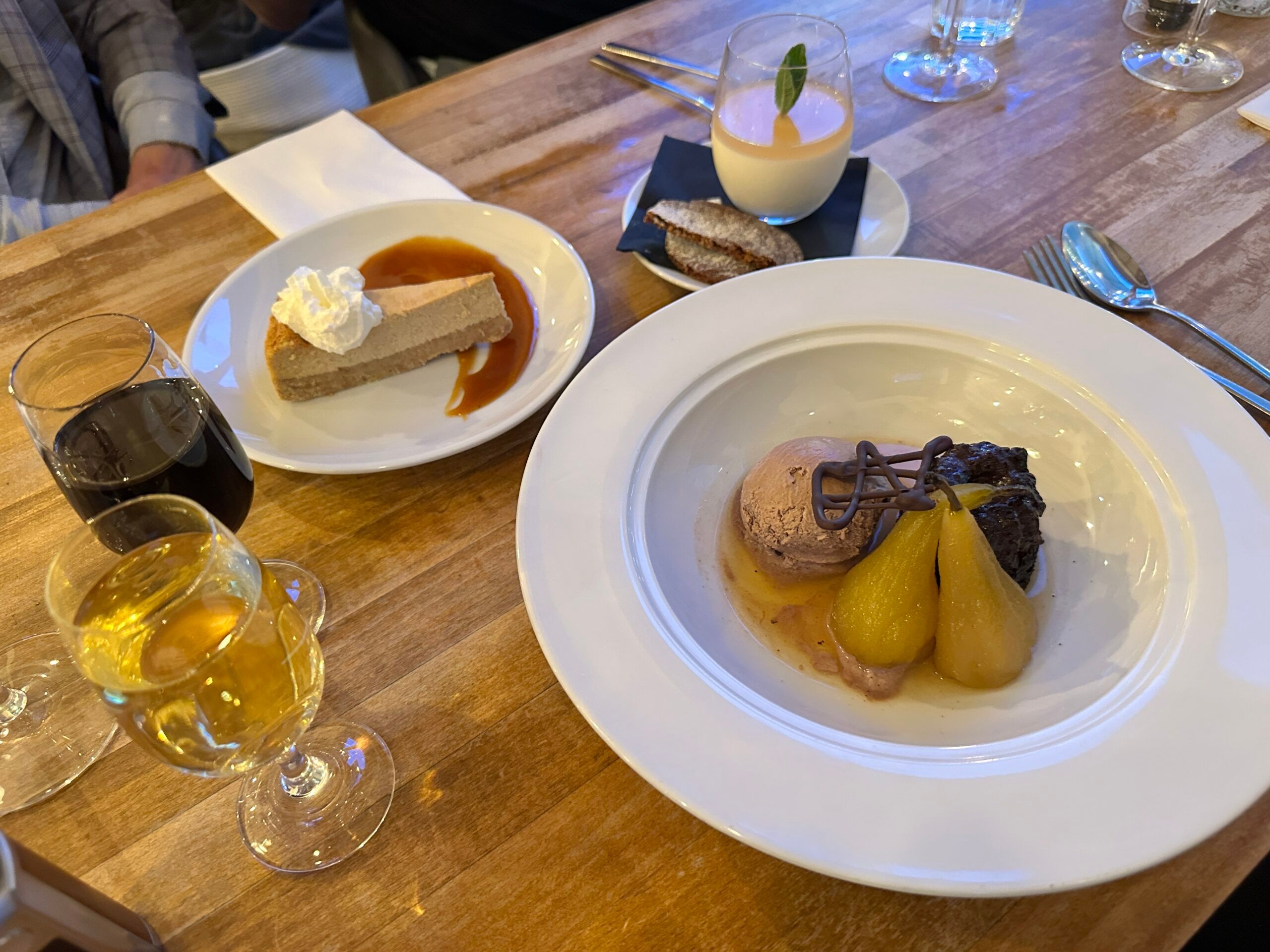 over head shot of two dessertes served on white plates. Visit to a beauteous bistro in Sussex 