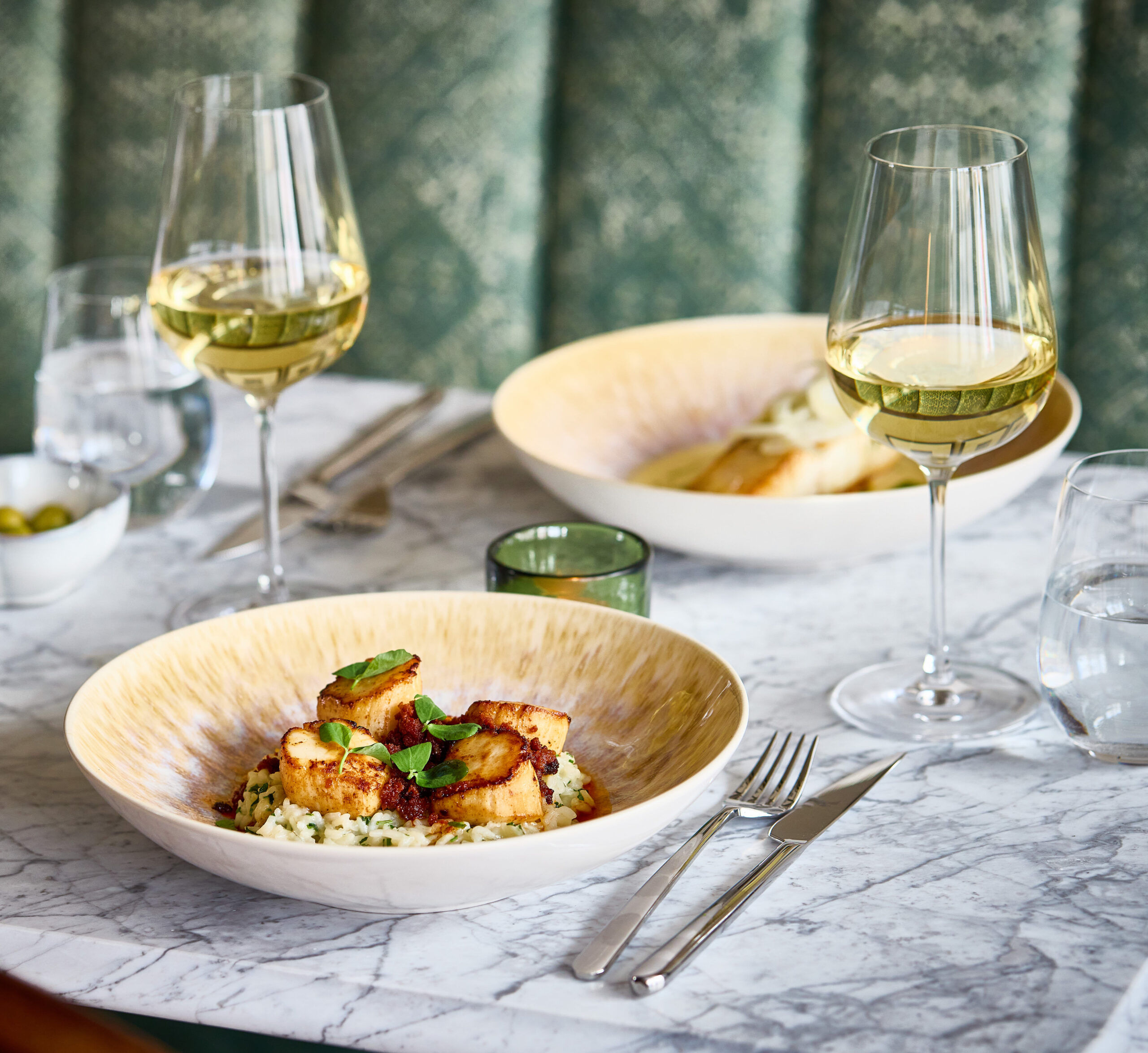 Scallops and halibut with green seating
