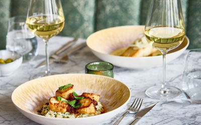Scallops and halibut with green seating