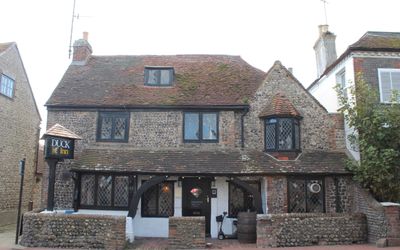 the exterior of the Duck Inn pub in historic Rottingdean