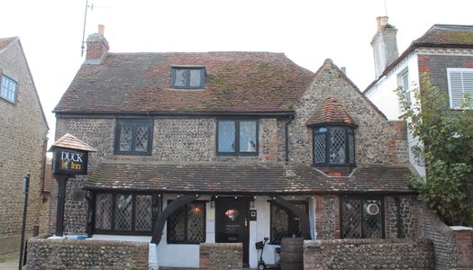 the exterior of the Duck Inn pub in historic Rottingdean
