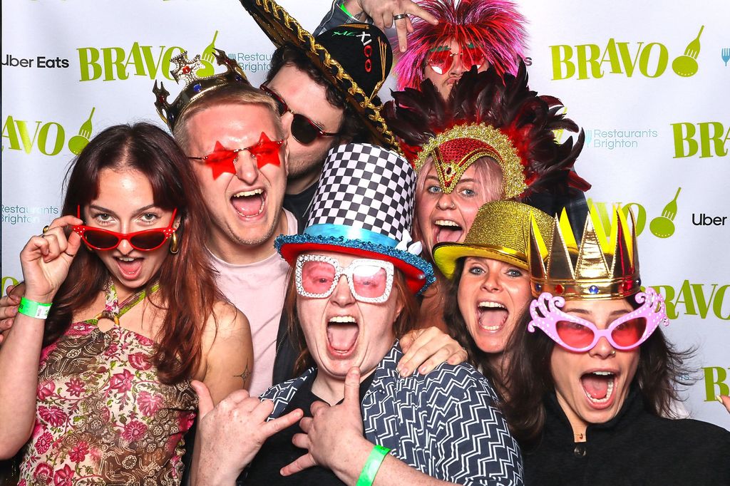the jolly sportsman team using the photo booth at the bravo party 2025