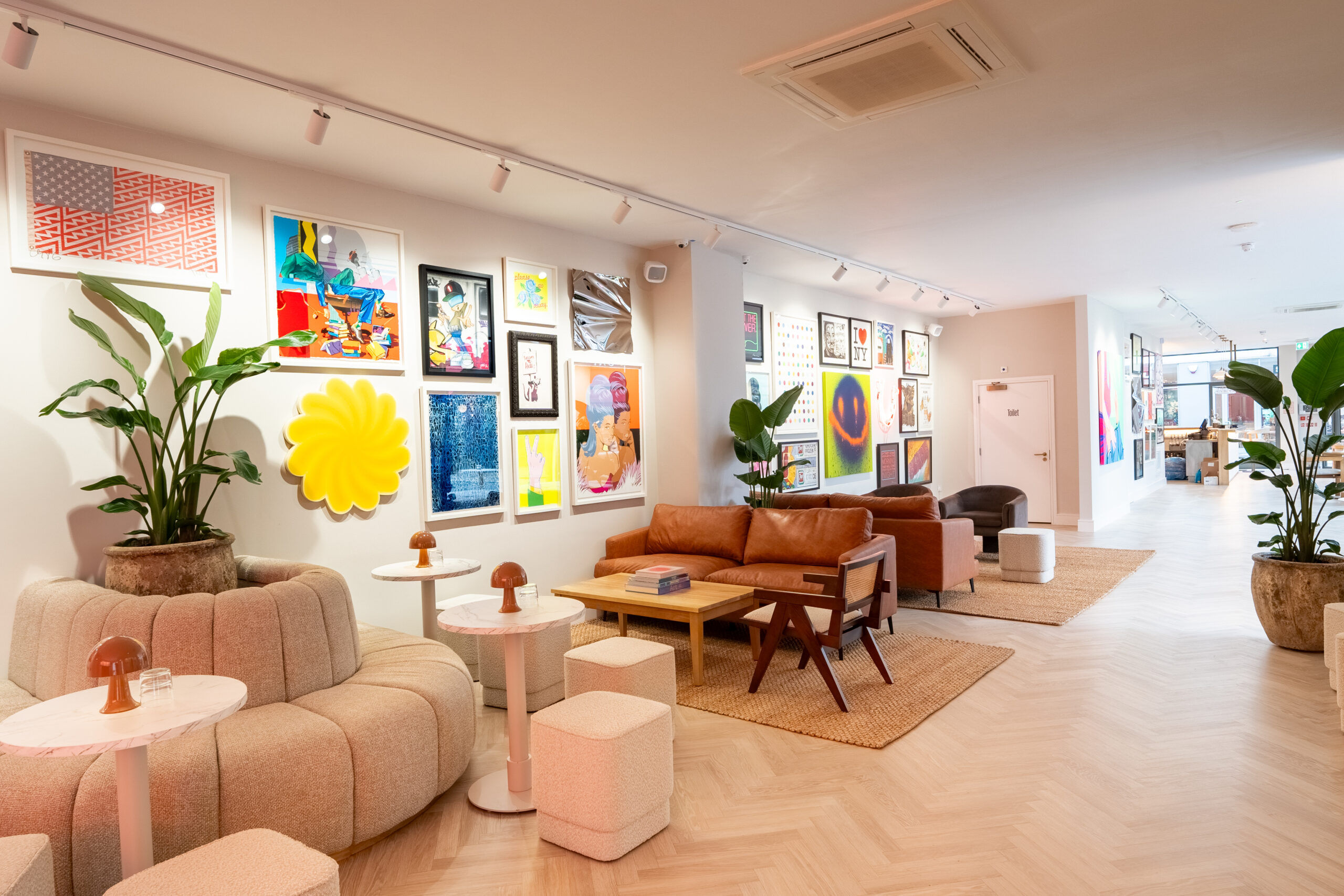 The bright interiors of Helm gallery with artwork on the wall.