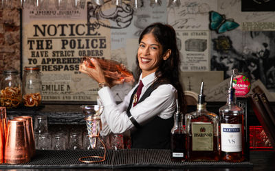 A cocktail being made at the bar