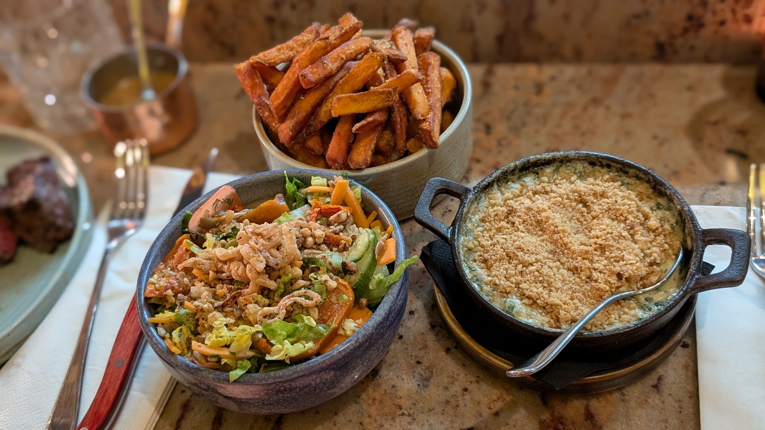 sides at Kindling including sweet potatoes, salad and pickled radish