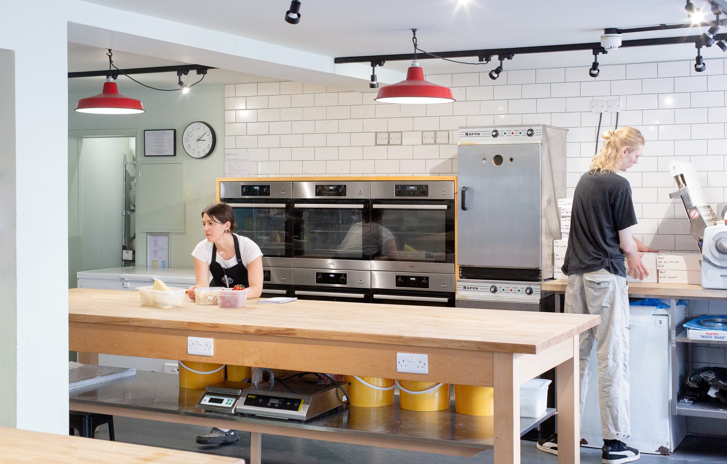 photo of two chefs preparing the kitchen for workshop - Open Bakery Cookery School