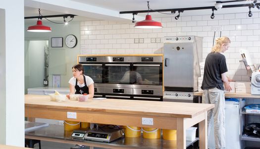 photo of two chefs preparing the kitchen for workshop - Open Bakery Cookery School