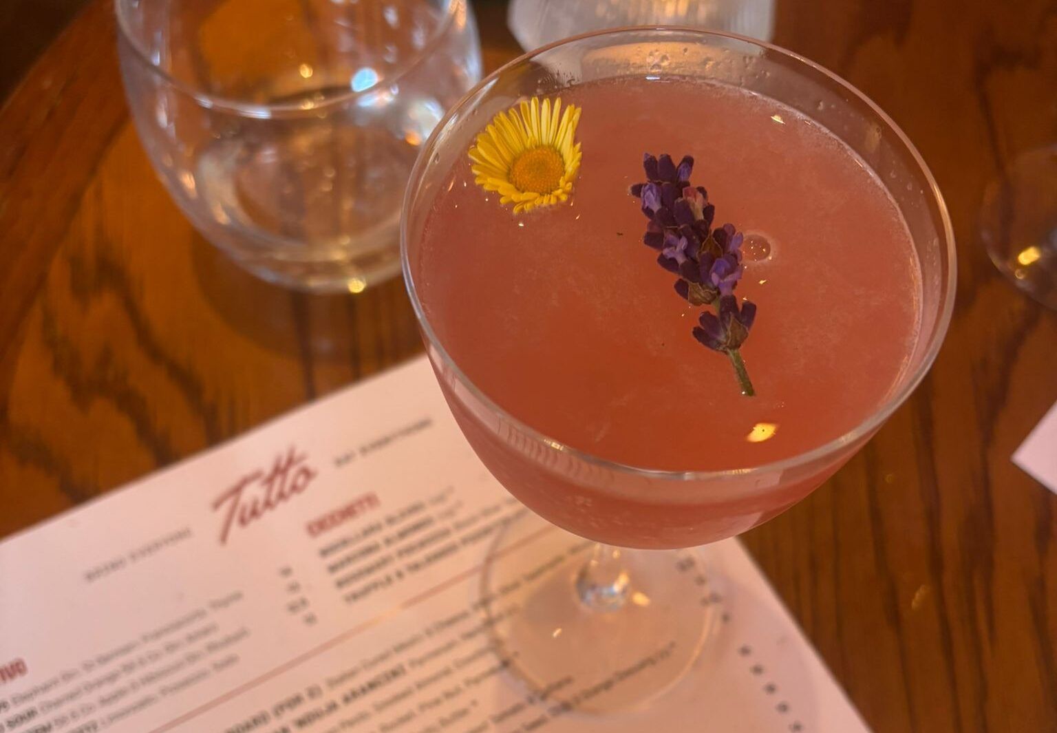 pink cocktail at the table. Picture from Italian-inspired cuisine at Tutto Brighton