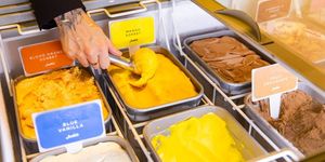 scooping mango ice cream