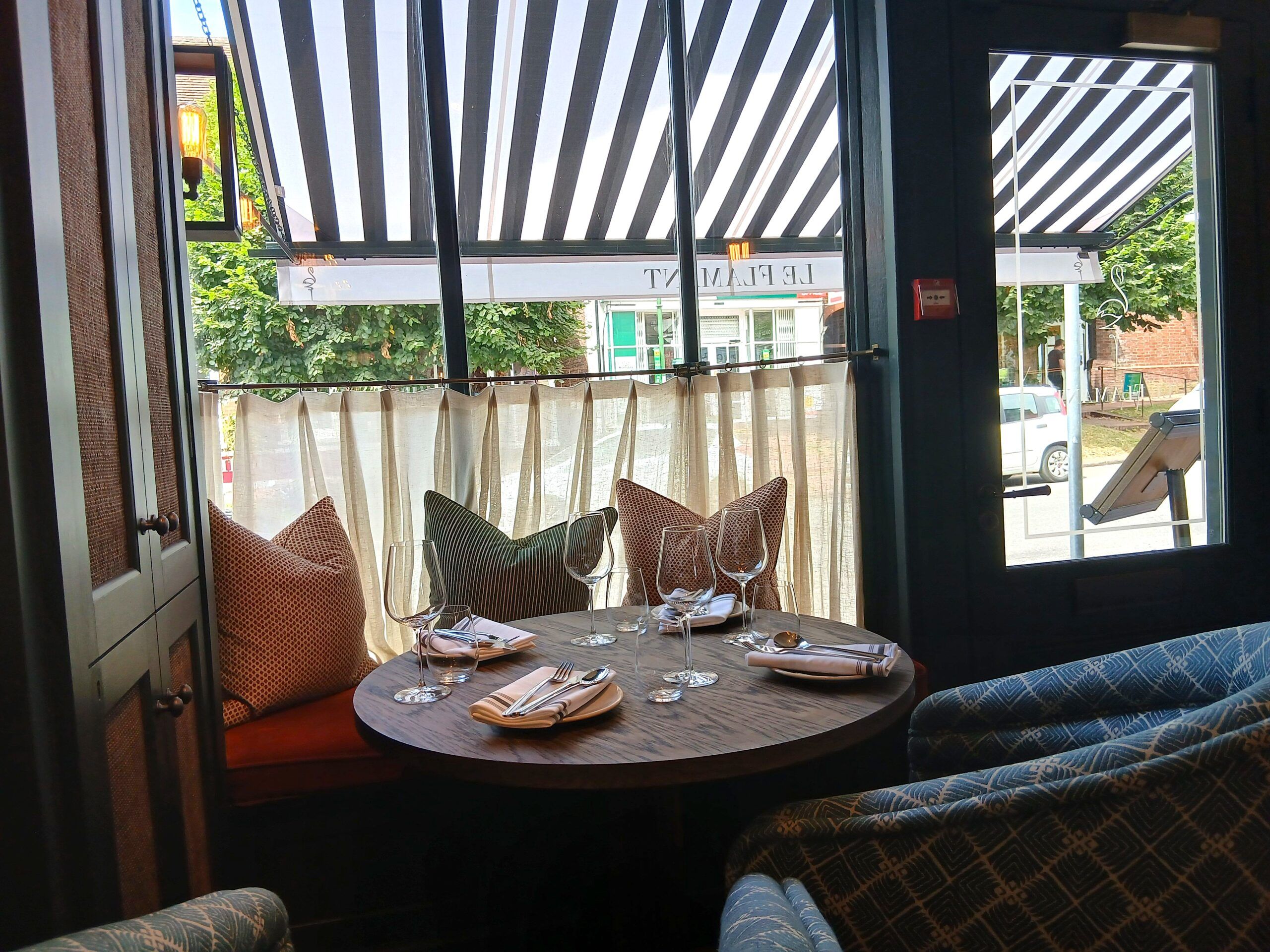 the shot of the table set up on the window seating