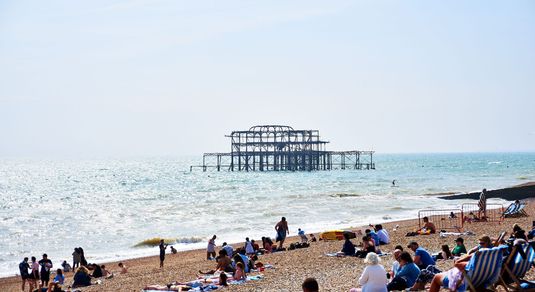 Brighton Beach - West Pier - people laying on the beach