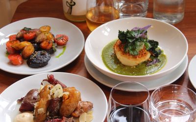 close up shot of three dishes at Dill served with wine