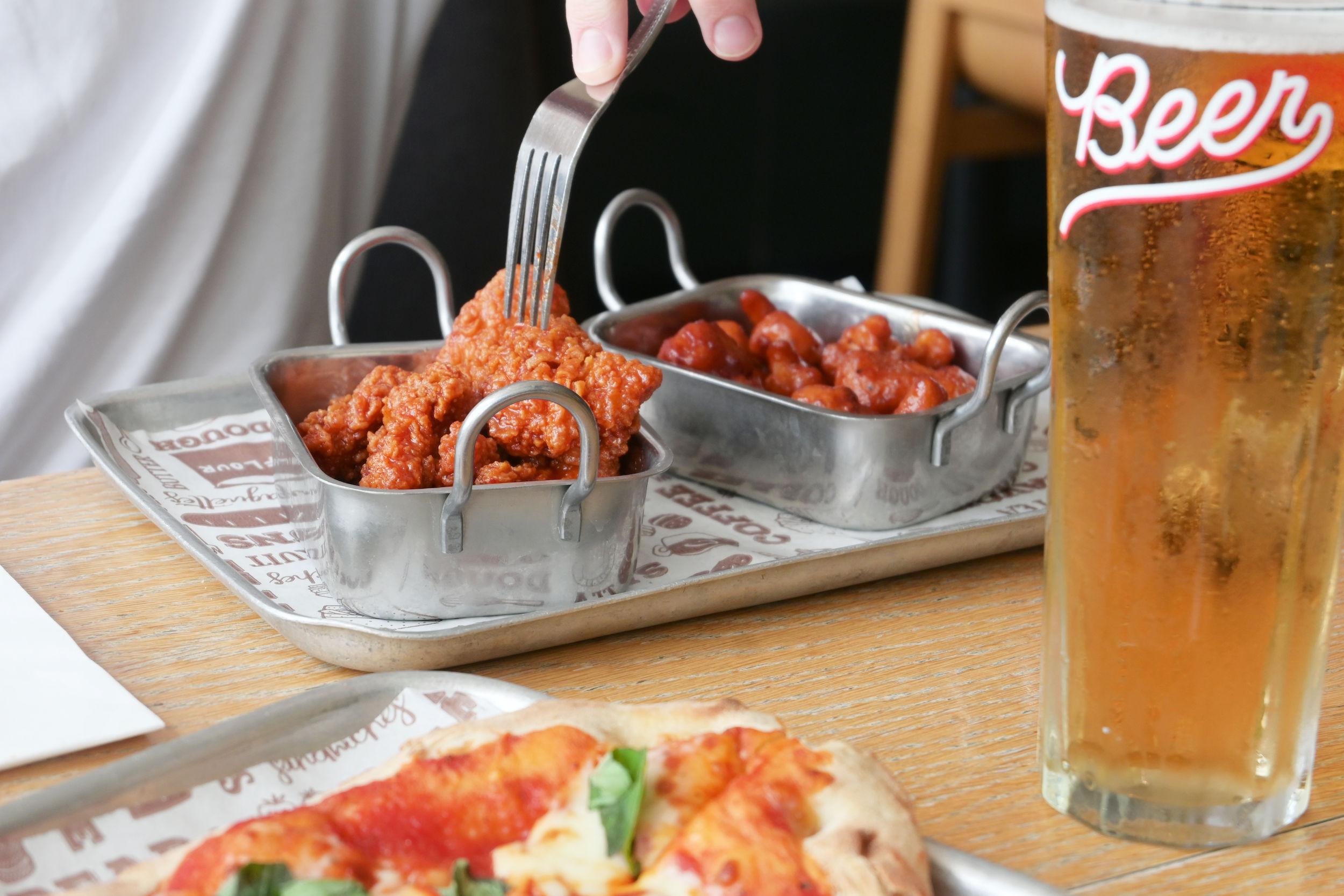 Plate of crispy fried chicken wings served at Bench Sports Bar Brighton
