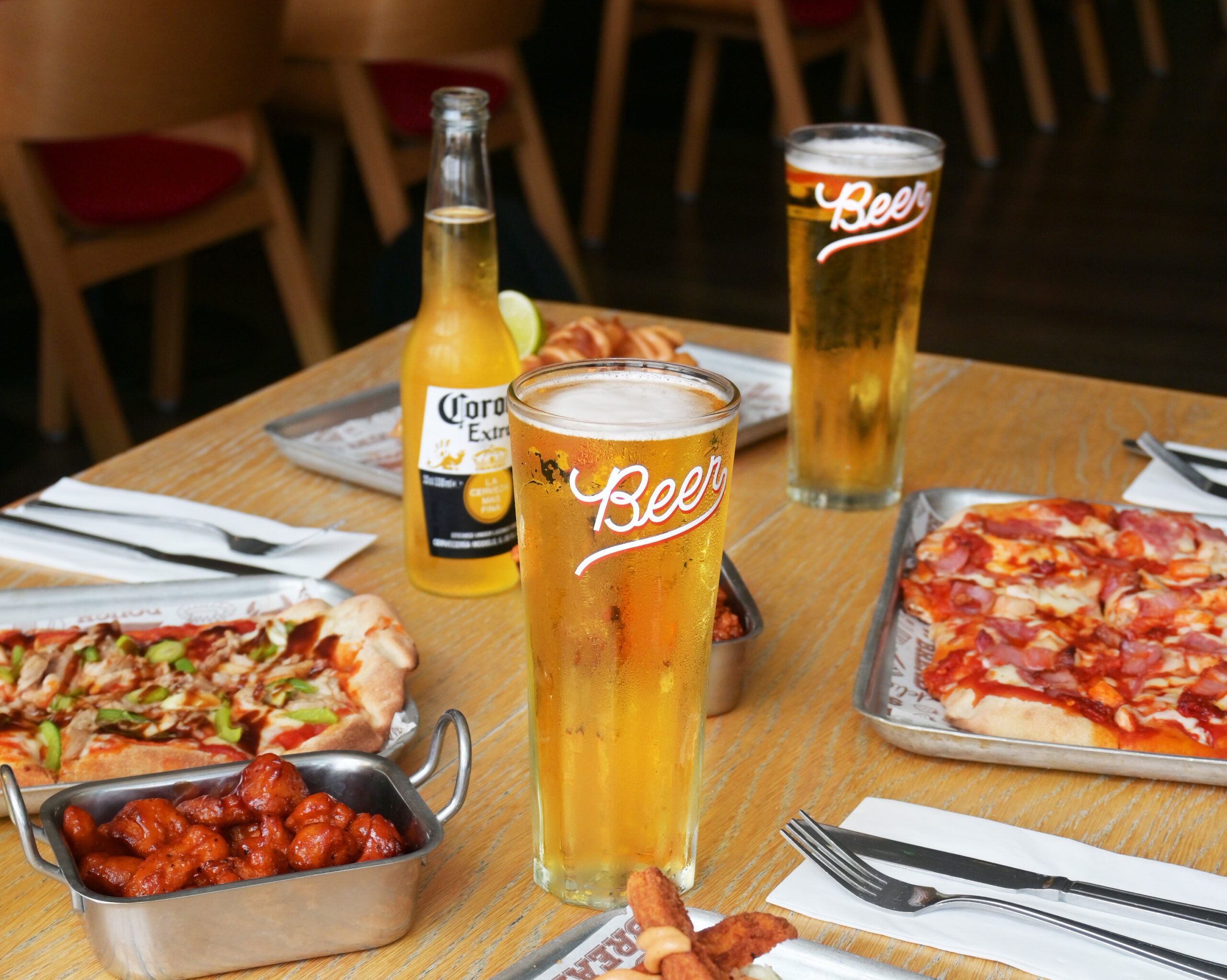 Table set with food and drinks at Bench Sports Bar in Brighton.