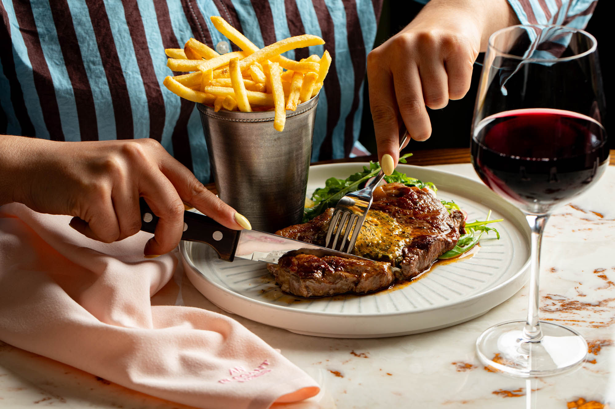 Beef carpaccio with crispy shoestring fries and rosé wine at Burger & Lobster Brighton