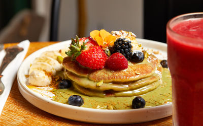 delicious pancakes with pistachio cream served on the white plate at Meo Brighton
