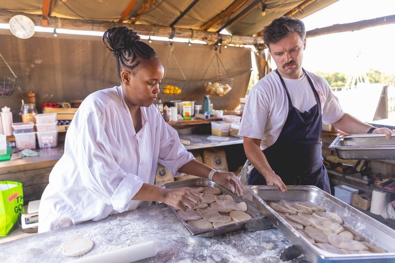 lady chef and a man chef preparing food