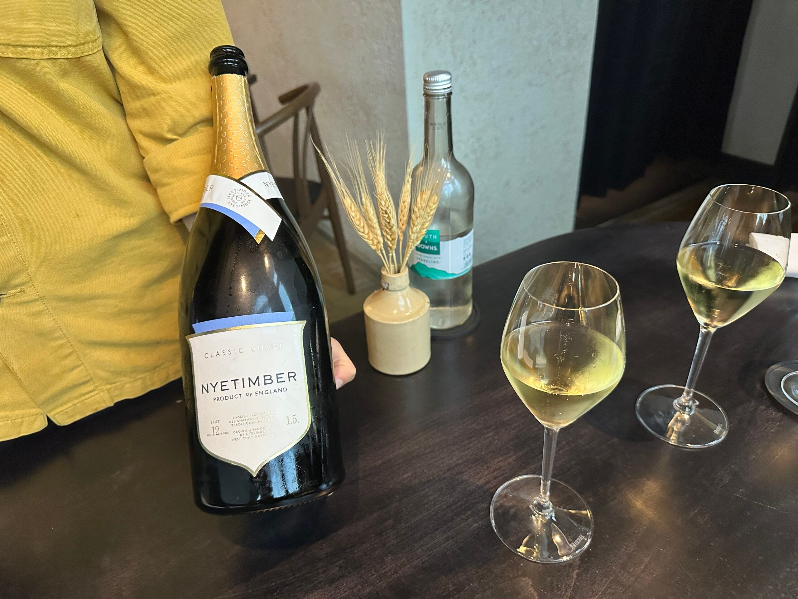 person holding Nytimber wine