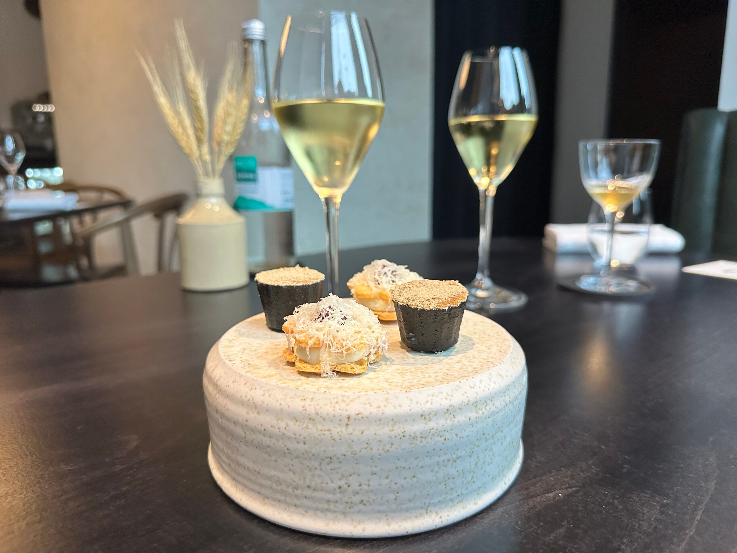 appetiziers served with glasses of champagne at etch.
