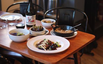 side shot of the table laid out with small plates and dishes at Dill Lewes