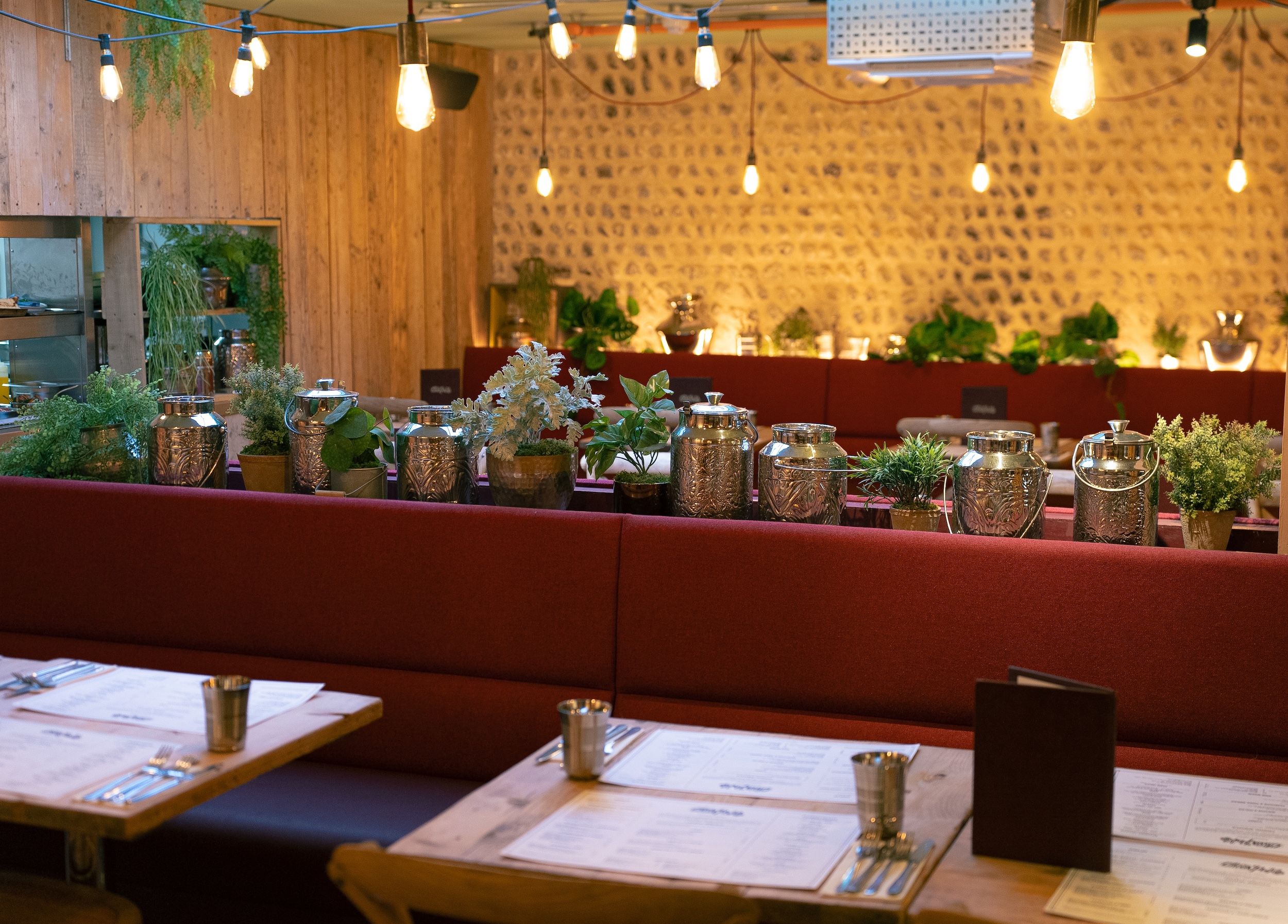 Brighton and airy restaurant, the Chilli Pickle table settings and banquet seating