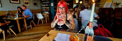 Jessica enjoying her aperol sprizt at Thai Night at River Beach Cafe