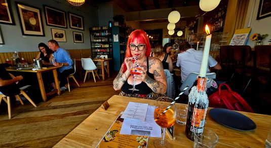 Jessica enjoying her aperol sprizt at Thai Night at River Beach Cafe