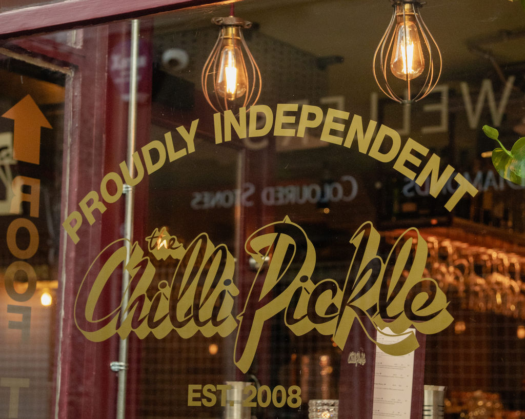 The Chilli Pickle displays ' Proudly Independent' in their window