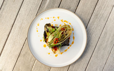 over head shot of the dish served on white plate