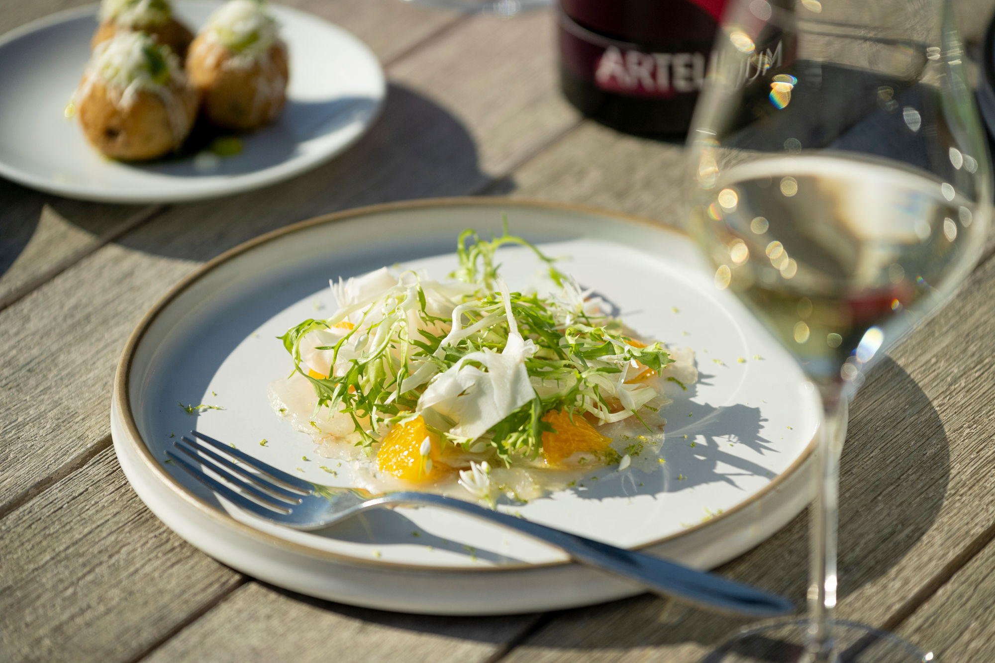 side shot of the dish and glass of sparkling