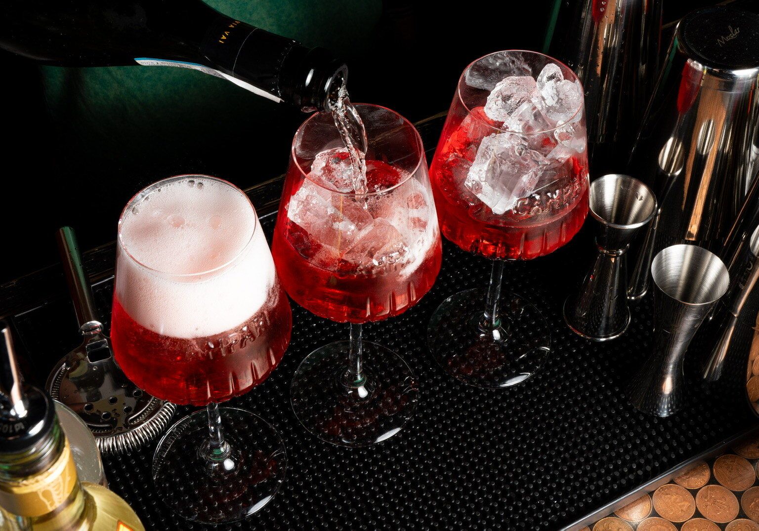 three red drinks next to each other, served at the bar of Bar 50ml brighton