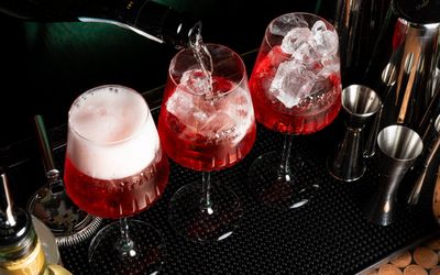 three red drinks next to each other, served at the bar of Bar 50ml brighton