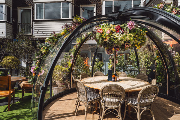 Alfresco igloo at Coppa Club Brighton in The Lanes decorated with summer flowers