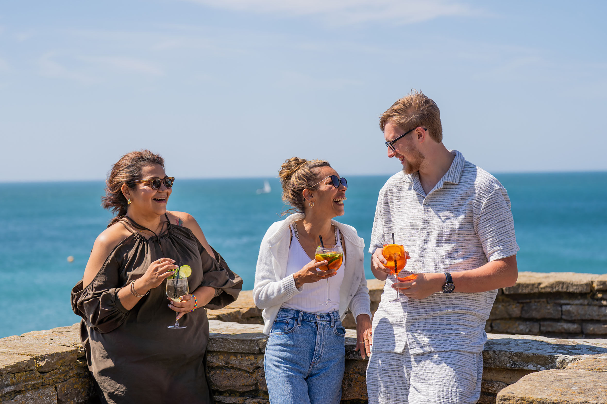 three friends having drink at the terrace of White Horses Rottindean