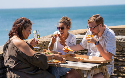 friends eating food at the terrace from White Horses