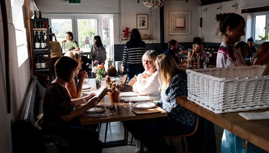 A dining room full of customers at Artelium Wine Estate