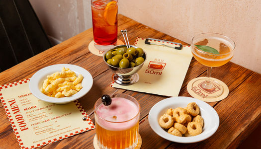 nibbles and cocktails served on the wooden table at bar 50ml