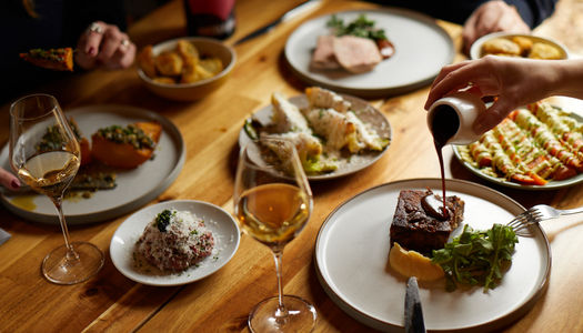 sauce being poured at lunch at Artelium