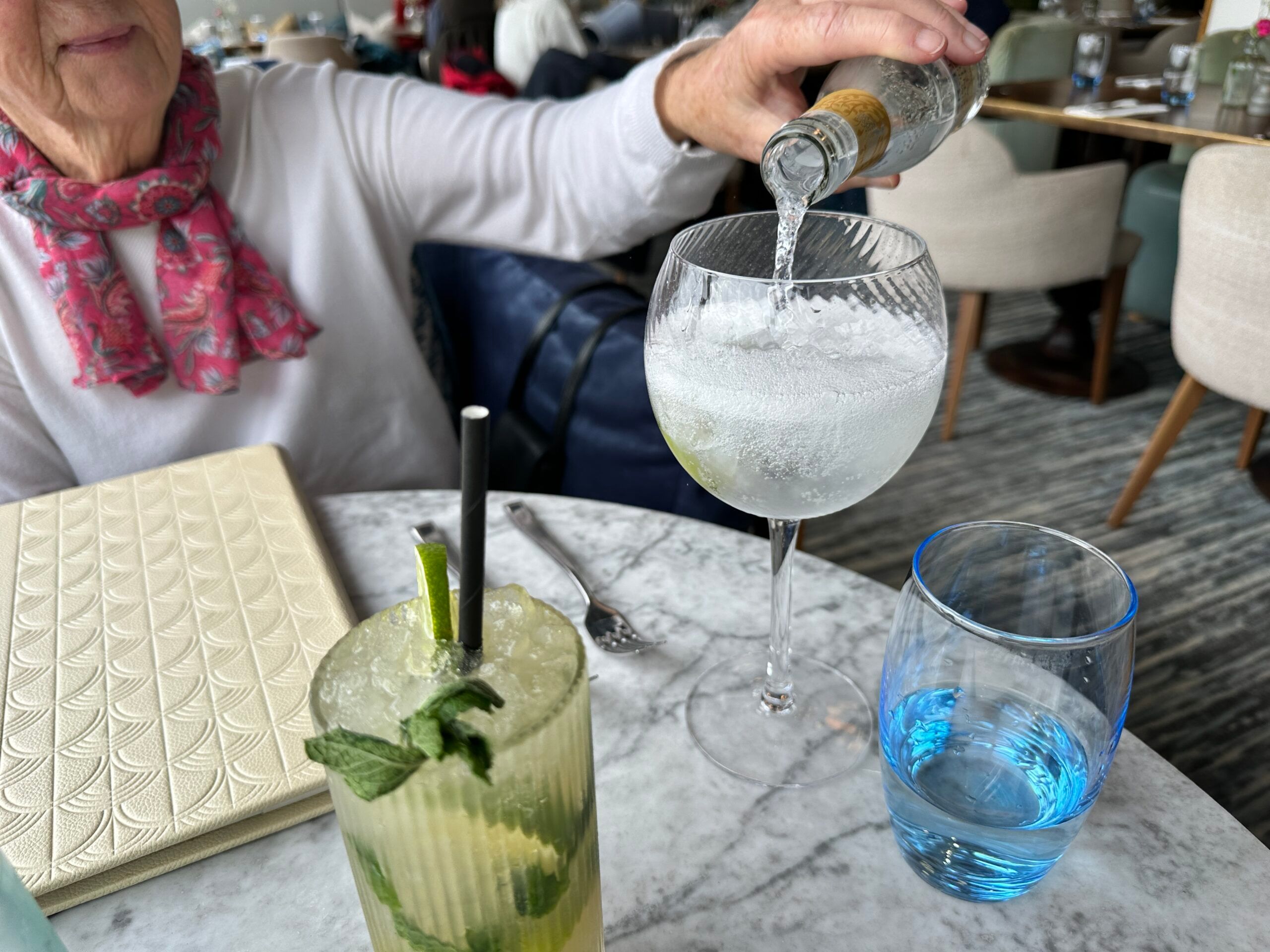 sipping gin in the glass