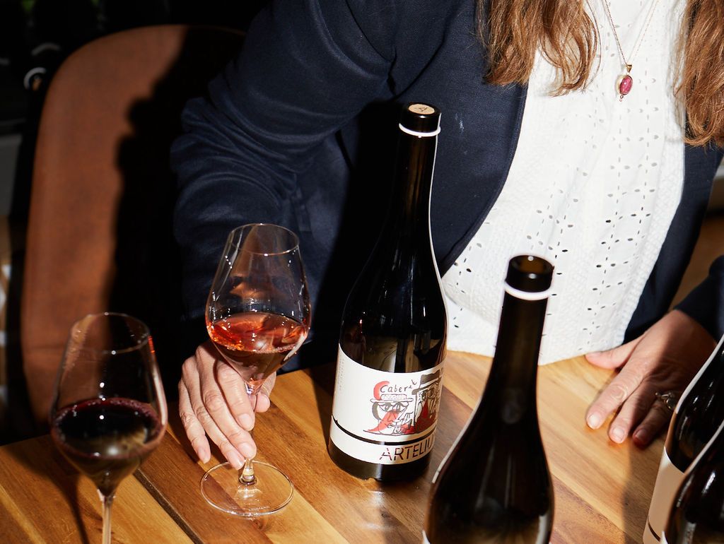 Wine tasting a glass of Rose at Artelium