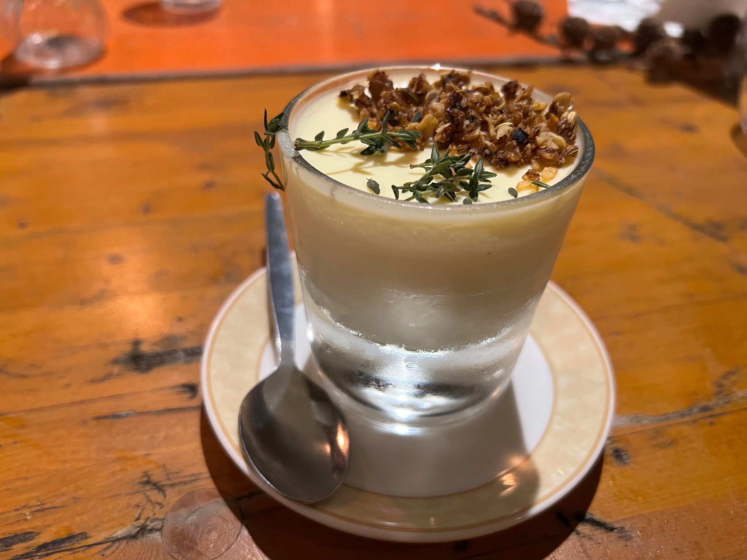 lemon posset with crunchy granola and herbs 