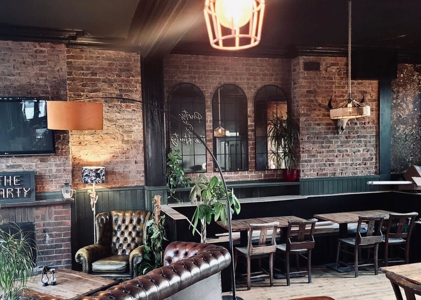 spacious bar area at The Hatrington Pub in Hanover, wooden tables and mirrors