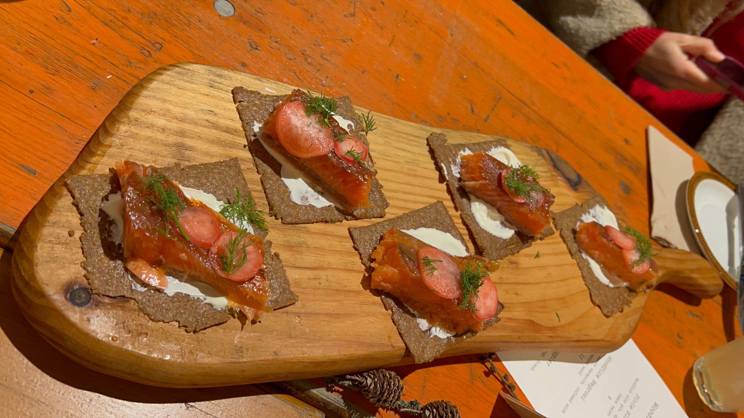 hot-smoked chalk-stream trout on rye with crème fraiche and horseradish.