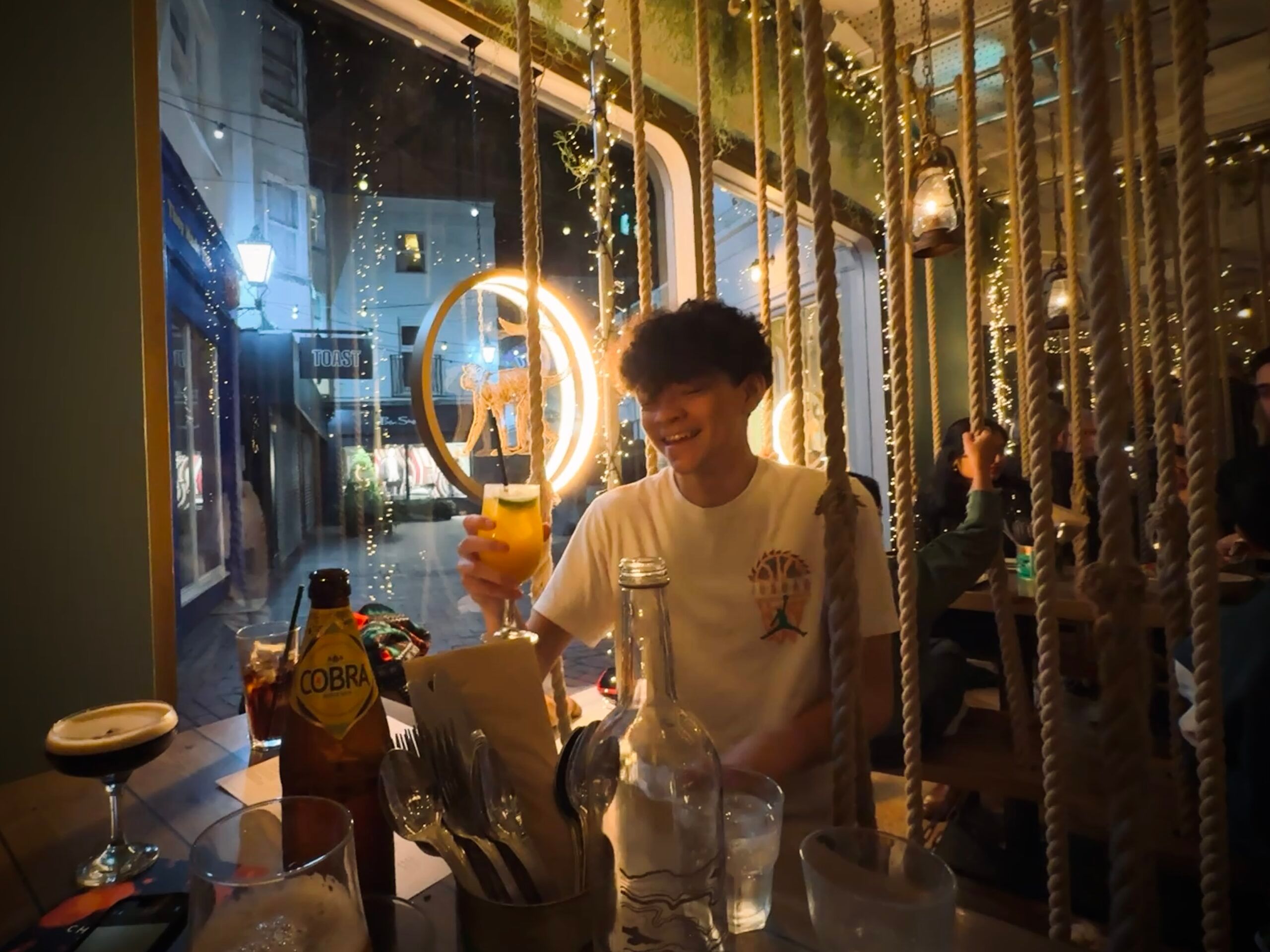 teenager on the Mowgli Swing holding his juice