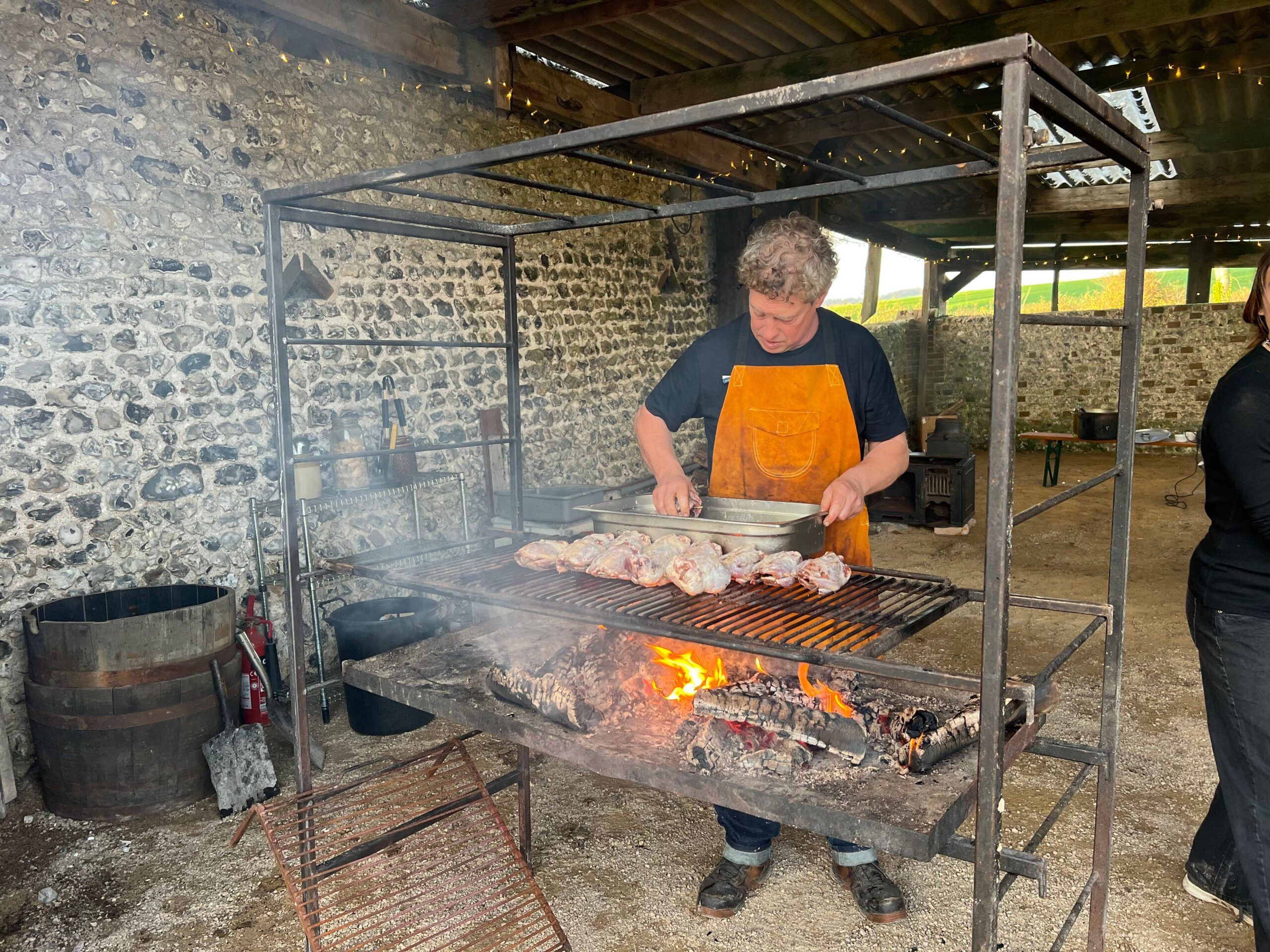 Griff preparing food at Woodfire Camping