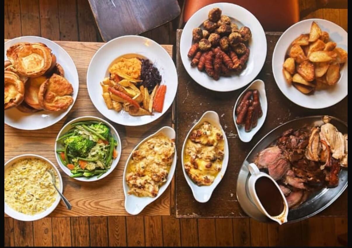 A selection of Sunday Roast dishes at The Hartington. Pigs in blankets, roast potato, cauliflower cheese, brocolli, a plate of roast beef and gravy, The Hartington pub