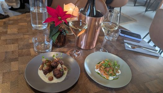 Jerusalem artichokes and juniper-cured salmon served on the table