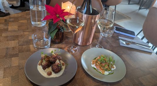 Jerusalem artichokes and juniper-cured salmon served on the table
