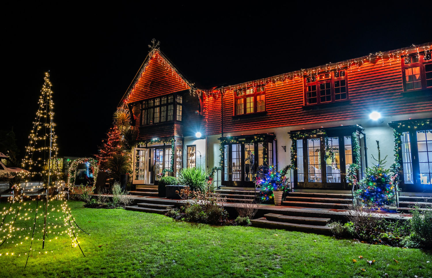 Christmas Light Display at Tottington manor, restaurant Terra. The restaurant lit up with cosy Christmas Lights.