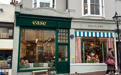 The green exterior of Ease Coffee Shop on Gloucester Road.
